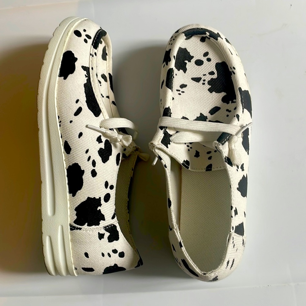 Cowprint slip on shoes